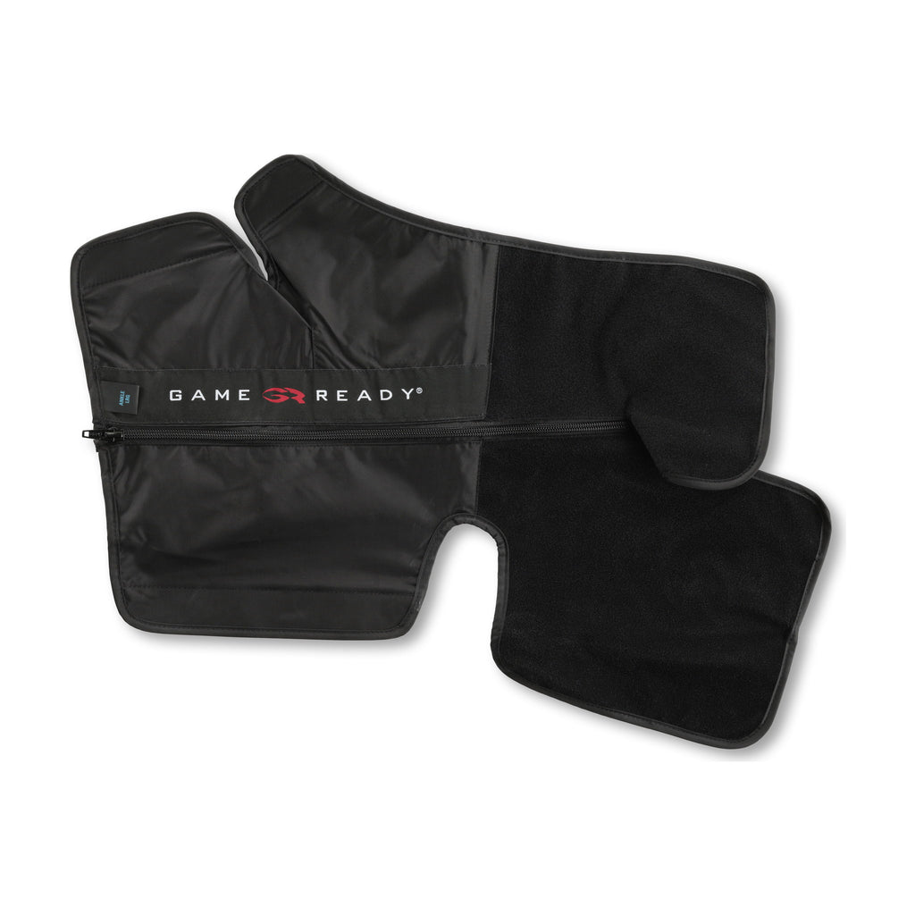 A black ankle sleeve opened flat on white, foot and calf sections spread, with the GAME READY wordmark across the zippered panel.