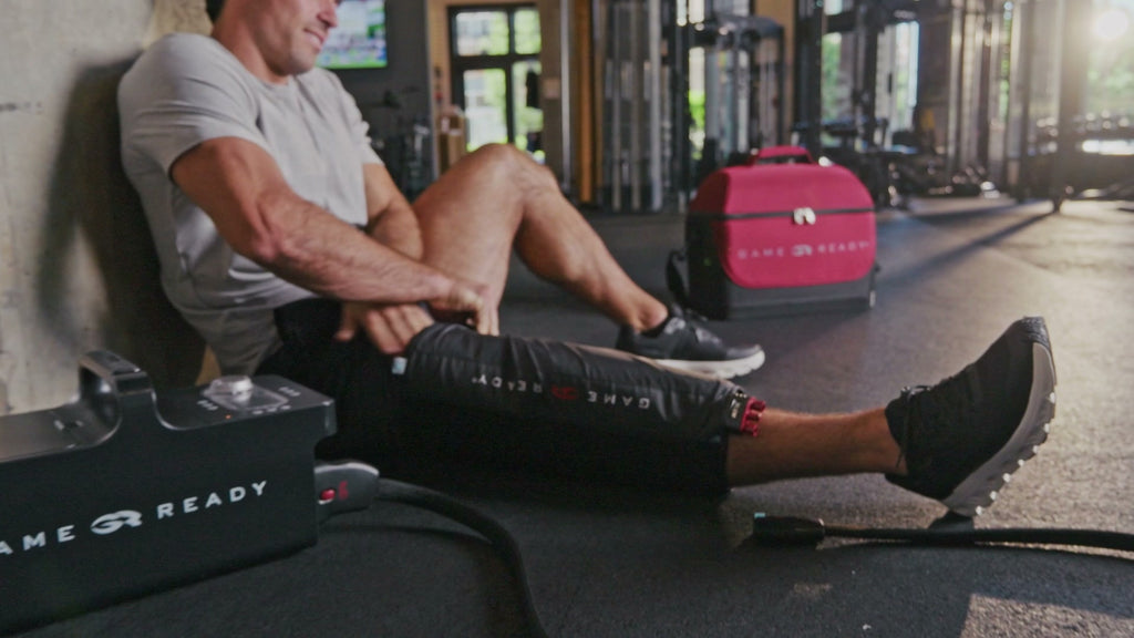Game Ready knee wrap in use after a gym session.