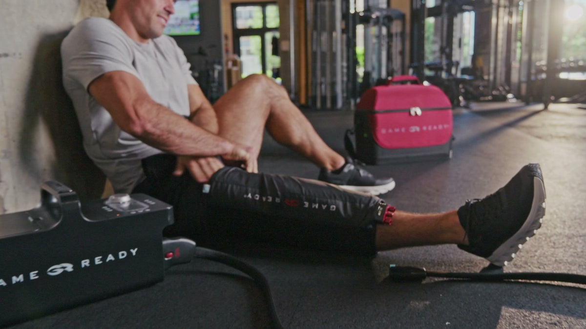 Game Ready knee wrap in use after a gym session.